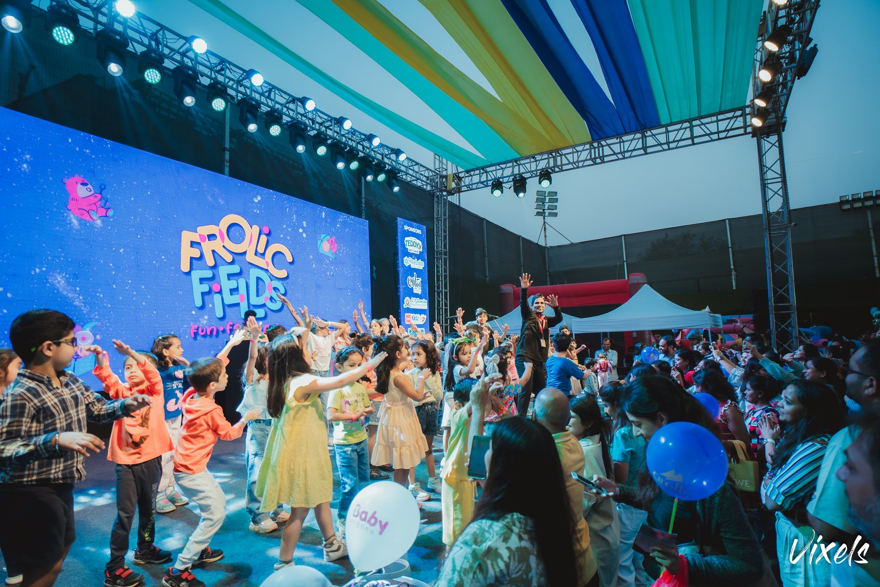Children dancing in front of the Frolic Fields main stage