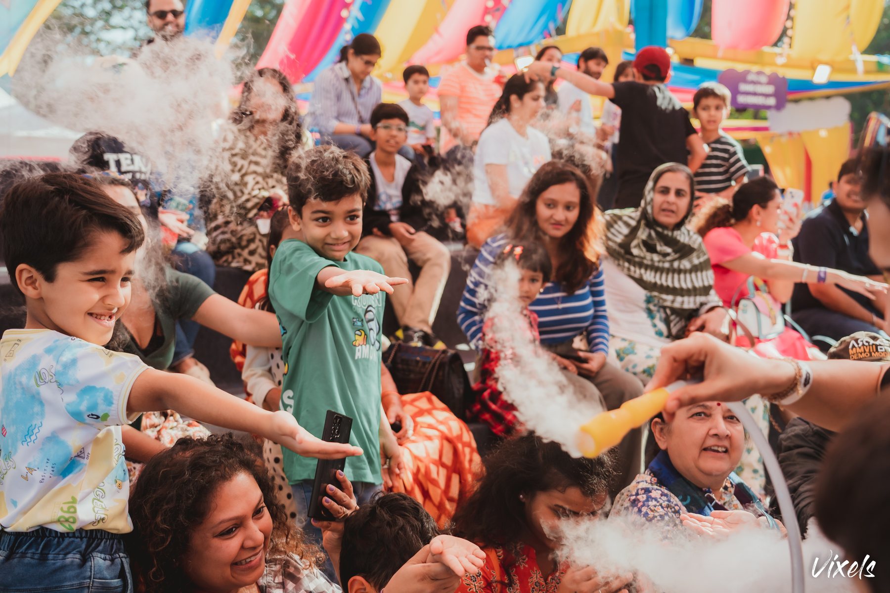 Families and children at a Frolic Fields activity zone
